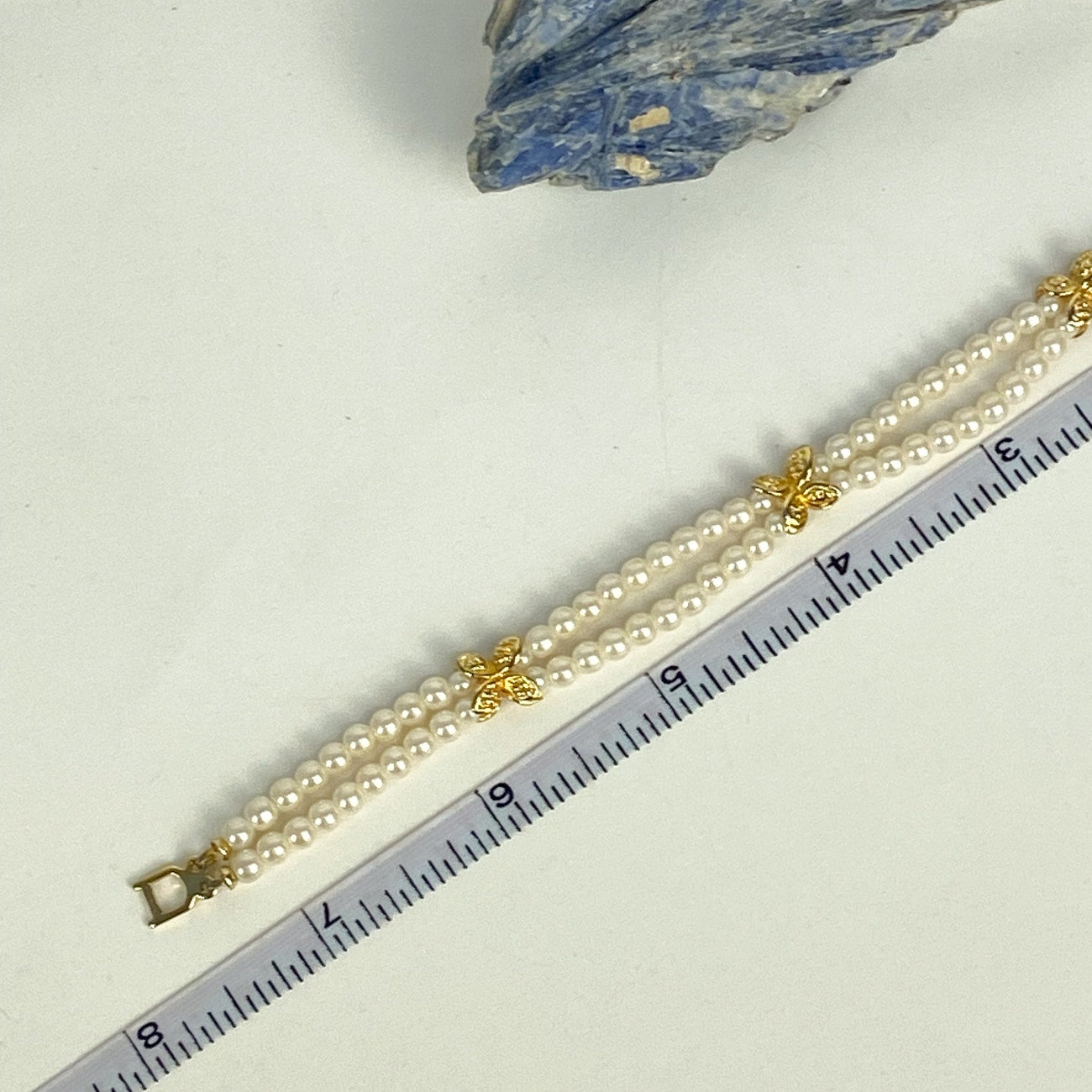 Double Strand White and Gold Tone Beaded Bracelet.