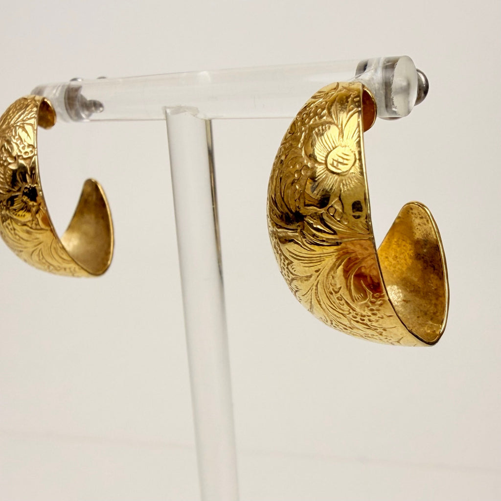 Gold tone floral design hoop earrings