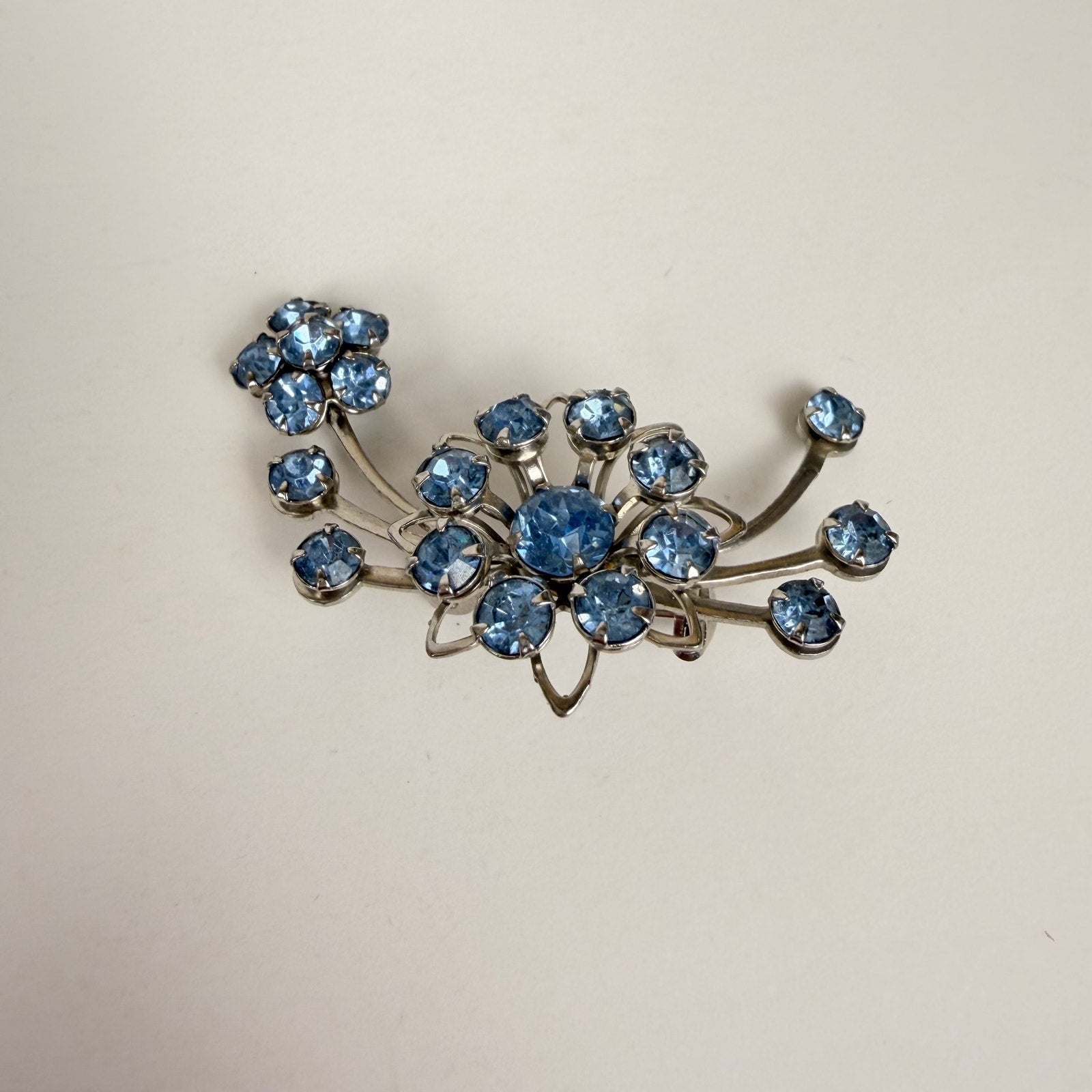 Silvery Floral Brooch with Blue Rhinestones