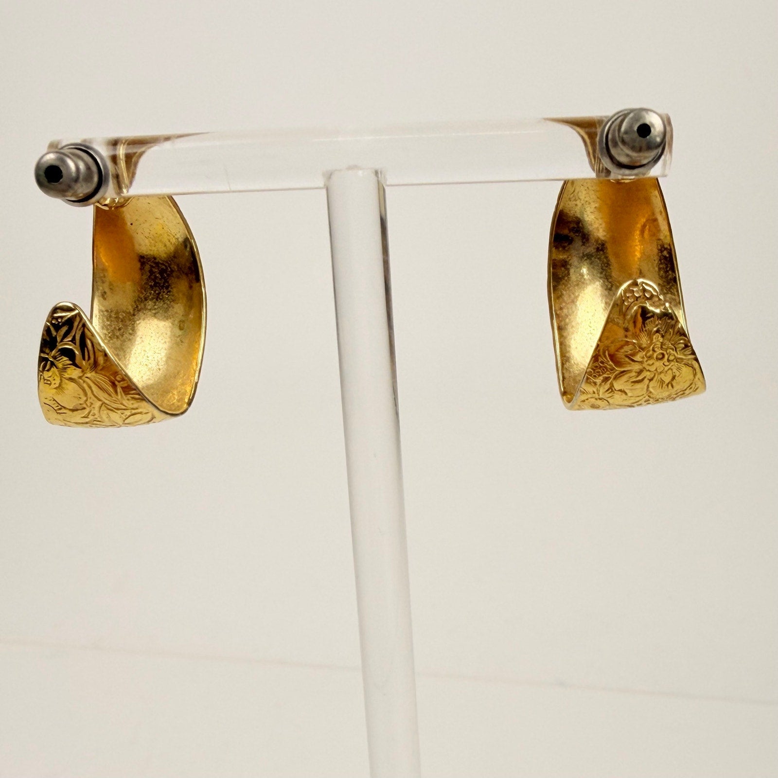 Gold tone floral design hoop earrings