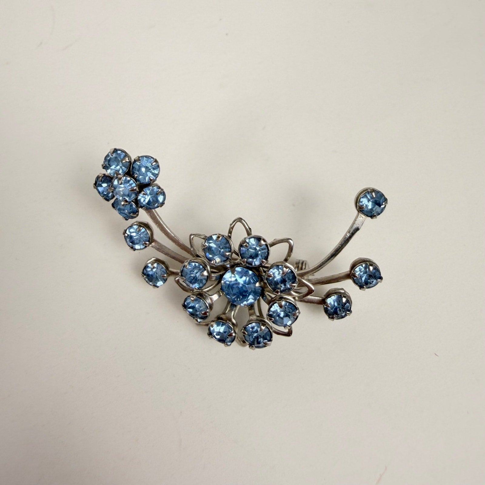 Silvery Floral Brooch with Blue Rhinestones