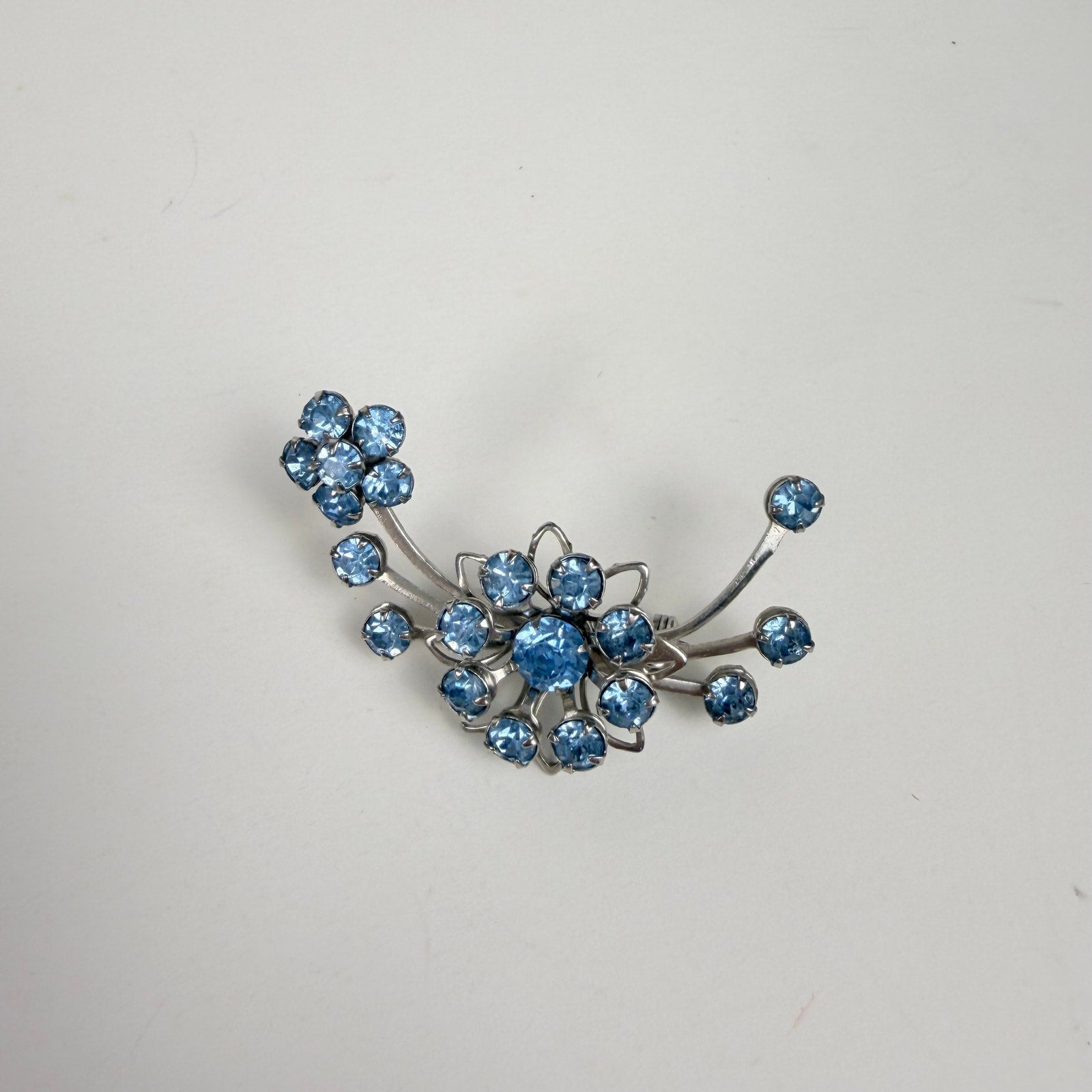 Silvery Floral Brooch with Blue Rhinestones