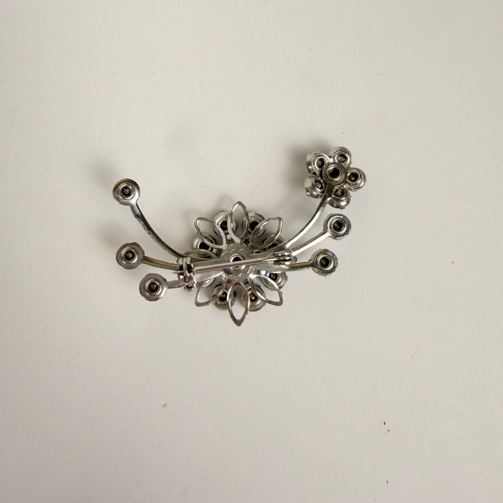 Silvery Floral Brooch with Blue Rhinestones