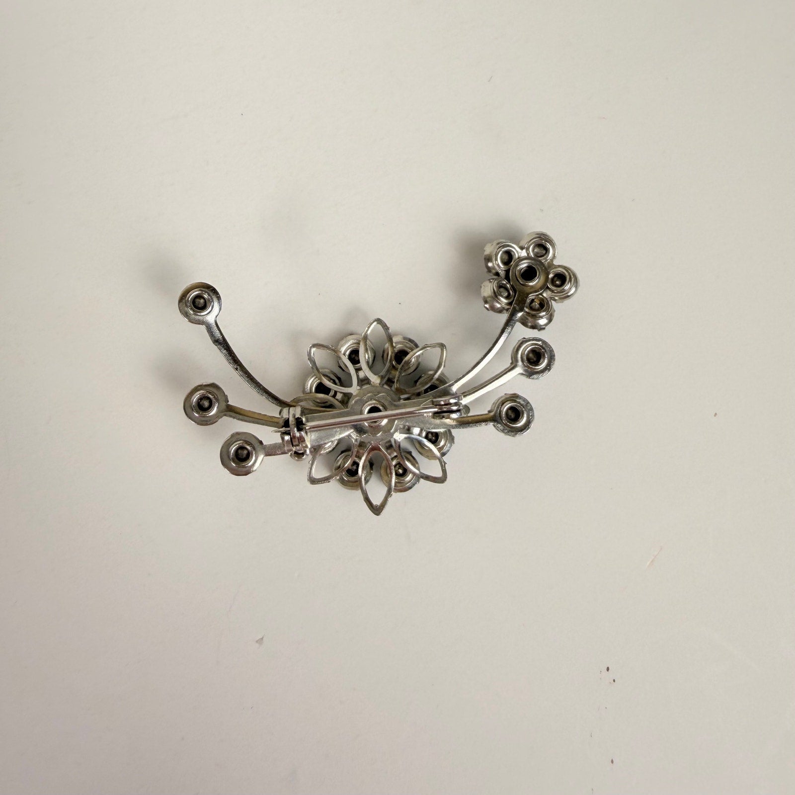Silvery Floral Brooch with Blue Rhinestones