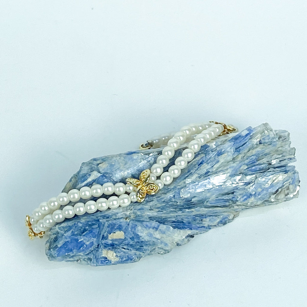 Double Strand White and Gold Tone Beaded Bracelet.