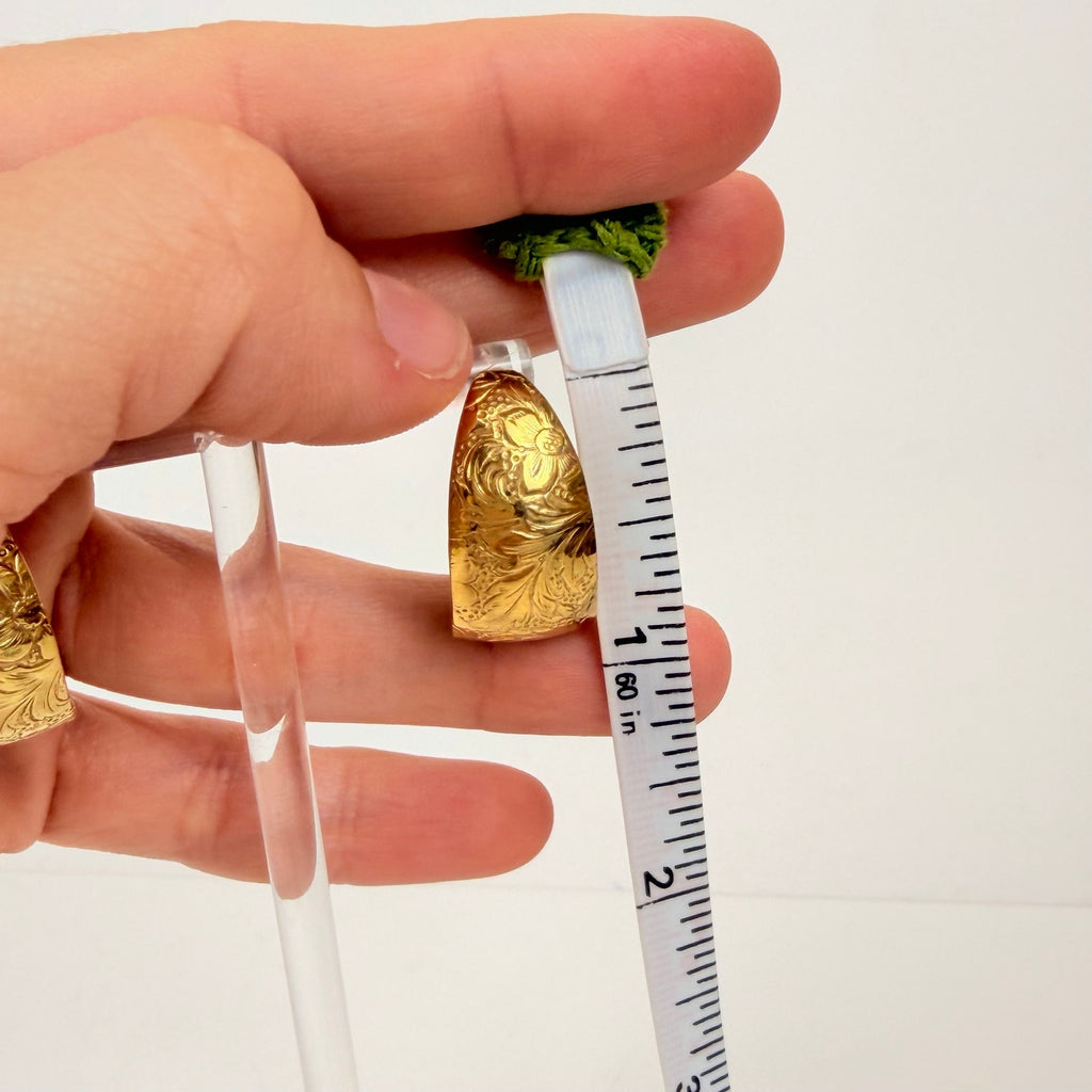 Gold tone floral design hoop earrings