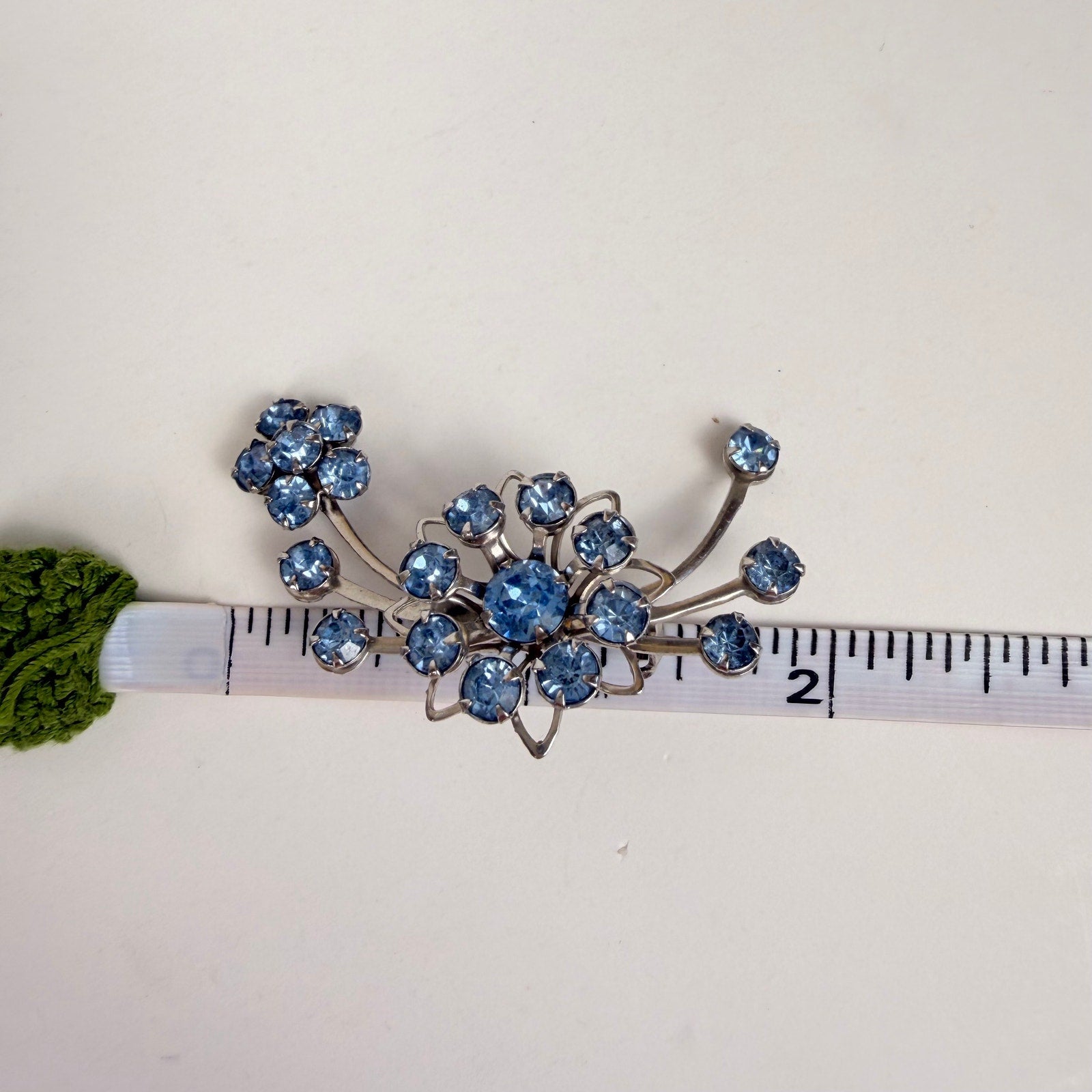 Silvery Floral Brooch with Blue Rhinestones