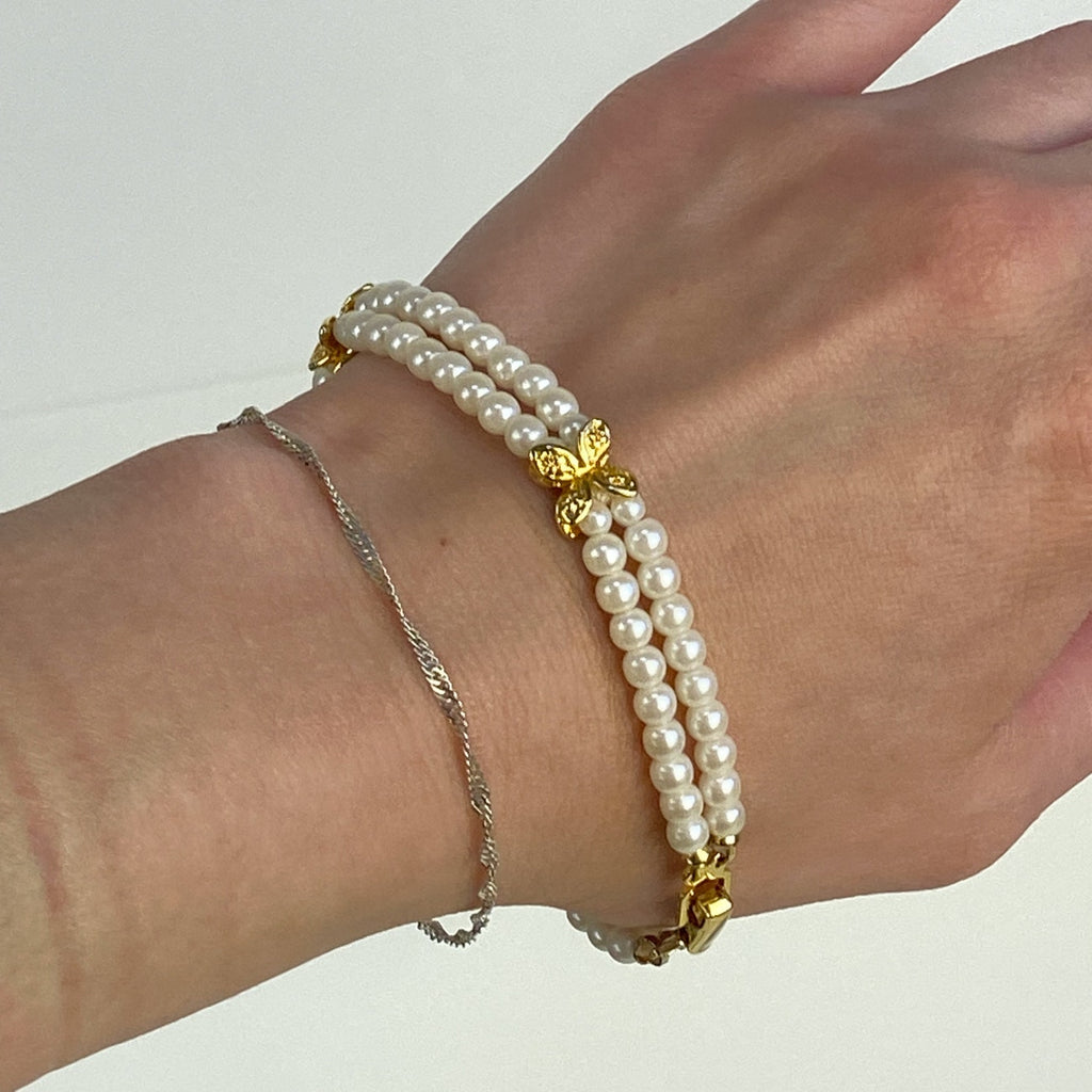 Double Strand White and Gold Tone Beaded Bracelet.